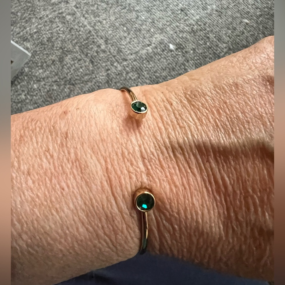 Alex and Ani emerald green flex gold tone cuff bracelet. Some wear to gold tone.